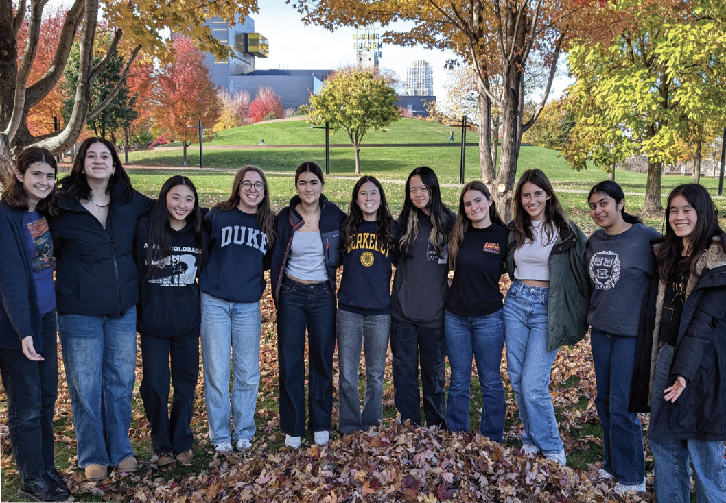 Members of the debate team pose for a photo at a tournament. 